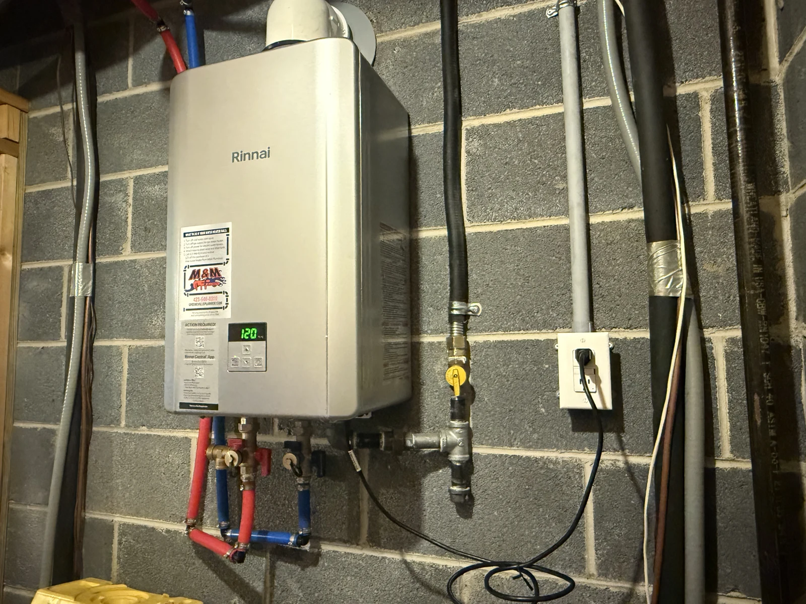 Wall-mounted tankless water heater and connections